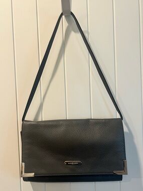 Michael Kors Pebble Leather Clutch Bag
Grey with silver hardware